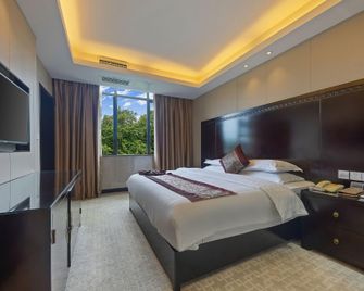 Wuyuan Ruiyi Xingjiangwan Holiday Hotel (Zhuzi Pedestrian Street) - Shangrao - Schlafzimmer