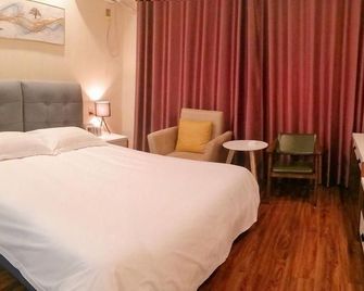 Hua Bin Hotel - Binzhou - Bedroom