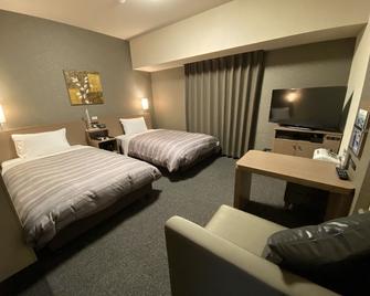 Hotel Route-Inn Sakurai Ekimae - Sakurai - Slaapkamer