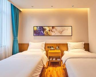 Wangjiang Holiday Hotel (Heihe Heilongjiang Riverside Branch) - Blagoveshchensk - Schlafzimmer