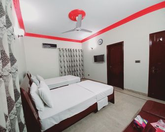 Cosy Inn Karachi Guest House - Карачі - Спальня