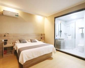 Greentree Inn Shandong Zaozhuang Tengzhou Fuqian Road Longquan Square Business Hotel - Zaozhuang - Slaapkamer