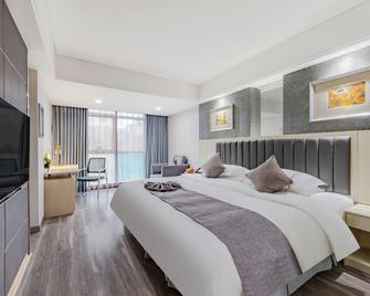 Anqing Mingjia Hotel - Anqing - Slaapkamer