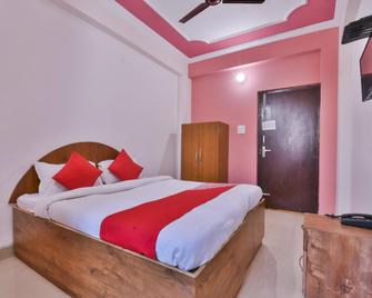 OYO Hotel Happy Journey - Patna - Yatak Odası