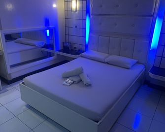 오요 509 타운 앤드 컨트리 레포소 - 마닐라 - 침실