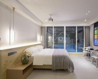 Sanya Haitang Bay Qingkongye Homestay (International Duty Free City Branch) - Sanya - Chambre