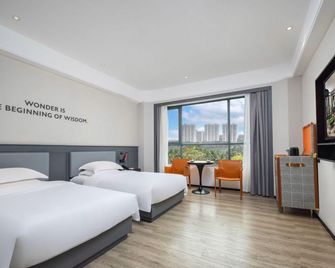 Fenghuangcheng Hotel - Wenchang - Camera da letto