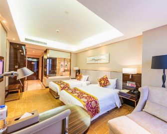 Wuhan Four Seasons Xinbaolai Hotel - Wuhan - Camera da letto