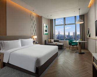 Holiday Inn Wuxi Central Station By IHG - Wuxi - Soveværelse