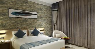 Click Hotel Bangalore - International Airport - Bengaluru - Bedroom