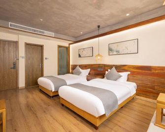 Jiuhuashan yisutingMinsu Inn - Chizhou - Schlafzimmer