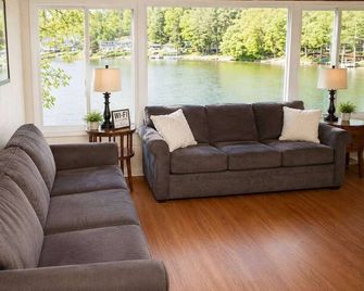 Quiet Lakefront Cabin · Private Dock and Firepit - Bath - Living room