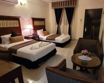 Ras Dika Hotel - ג'יבותי - חדר שינה