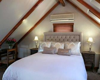 Roosenwijn Guesthouse - Stellenbosch - Phòng ngủ