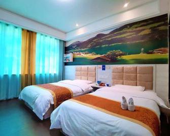 Jishida Express Hotel Yichun Chengdong - Yichun - Bedroom