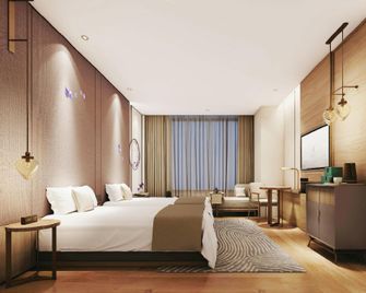 Dongchen Huanpeng Hotel (Chanba Convention and Exhibition Center Branch) - Xi'an - Schlafzimmer