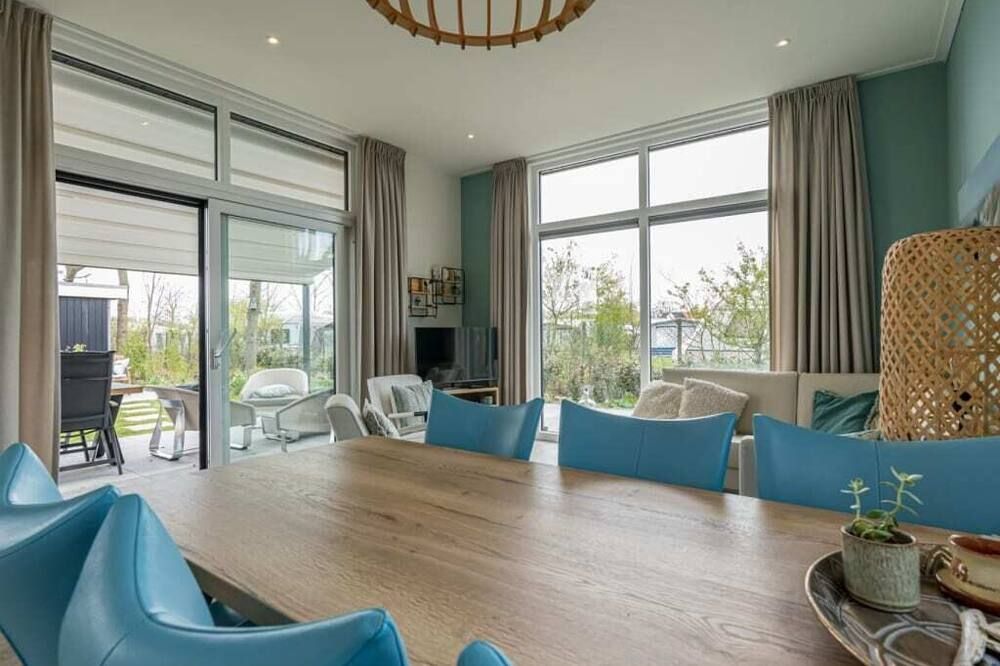 Garden-oriented, bright living room with an adjoining (electrically operated) patio coverbrLush garde - 巴勒哈姆斯泰德 - 餐廳