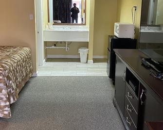 Caronoda Motel - Central City - Bedroom