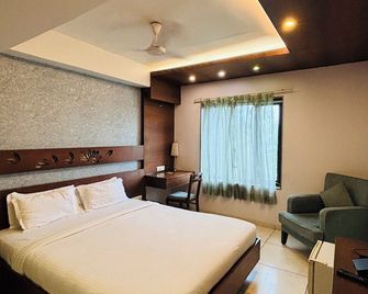 هوتل كانان - أحمد أباد - غرفة نوم