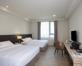 Floramos Hotel - Tianwei Township - Спальня