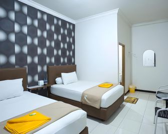 Palm Garden Hotel - Samarinda - Slaapkamer