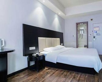Tianyi Boutique Hotel (Jingzhou Lianghu Market) - Jingzhou - Slaapkamer