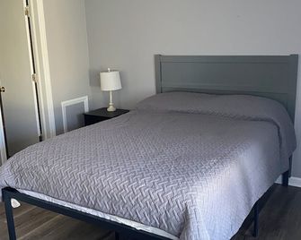 Super 7 Motel - קולומביה - חדר שינה