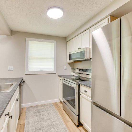 Kitchen view of Greenbrier River Retreat with Deck - Steps to Trail!