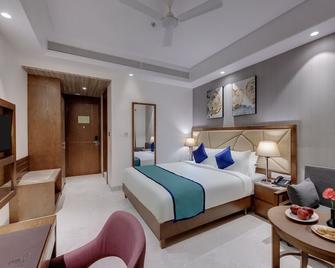 Click Hotel Aurangabad - Aurangabad - Phòng ngủ