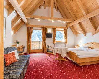 B&B Hotel Alpenrose Rooms & Apartments - Rodeneck - Schlafzimmer