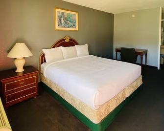 Travelers Place Inn & Suites - Scottsboro - Bedroom