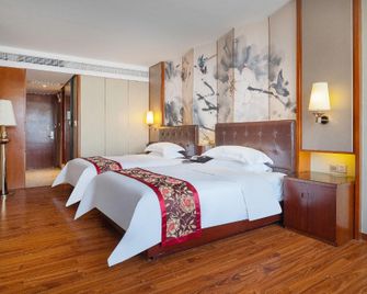 Yangjiang Minghao Hotel - Yangjiang - Спальня