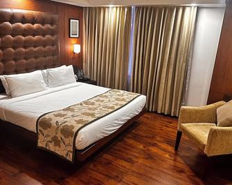 The Ocean Pearl Hotel - Mangaluru - Schlafzimmer