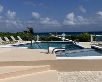 The Harvey Nicole: Modern Caribbean Ocean Front Condo Grand Cayman. - North Side - Pool
