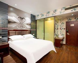 Shell Hotel (Xinxiang Pang Donglai Branch) - Xinxiang - Bedroom