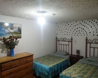 إسكوسي - كويتو - غرفة نوم