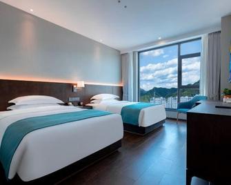 Tianbao Hotel - Čcheng-te - Ložnice