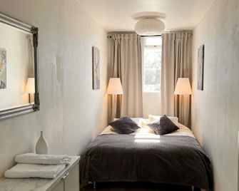 Casa Dísa - Apartments A Boutique Guesthouse in Reykjavik City`s Central Park and Botanical Garden in Laugardalur, Hot-Spring-Valley - ريكيافيك - غرفة نوم