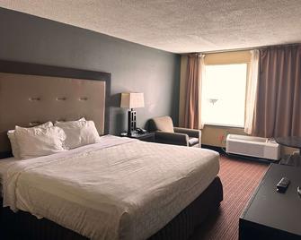 Days Inn & Suites by Wyndham Norton Shores/Muskegon - Muskegon Heights - Slaapkamer