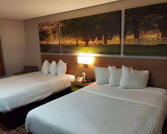Days Inn & Suites by Wyndham Huntsville - Huntsville - Bedroom