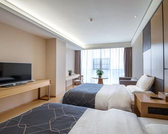 Chonpines Hotels·Leshan Giant Buddha - Leshan - Bedroom