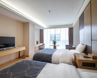 Chonpines Hotels·Leshan Giant Buddha - Leshan - Camera da letto