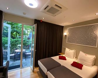 Alp Hotel - אמסטרדם - חדר שינה