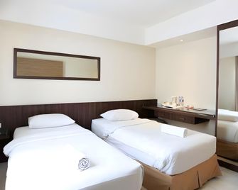 Cititel Hotel Pekanbaru - Pekanbaru - Schlafzimmer