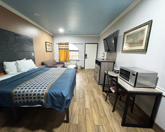Downtowner Inns And Suites - Humble - Phòng ngủ