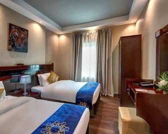 Al Bustan Tower Hotel Suites - Sharjah - Bedroom