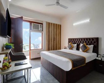 Hotel La Corporate Suite - Noida - Schlafzimmer