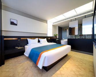 Zhangye Ruichi International Hotel - Zhangye - Schlafzimmer