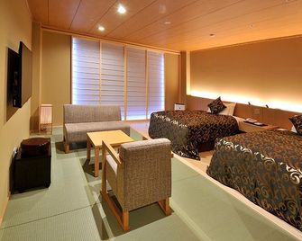 Kurashiki Yuga Onsen Hotel Santo-Ka - Kurashiki - Slaapkamer