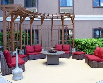 Outdoor Pool + Free Breakfast | 24 Hour Business Center + Fitness Center - Stafford - Patio